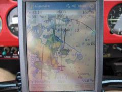 Here I have deviated from the direct route (the bold line) and am using the XM Weather to fly a rain-free path around Tyler on the way to Longview. This is one of the 6 customized Views, and in this view you can also see towers and the green circles that show airports reachable by engine-out best glide IMG_2734.jpg